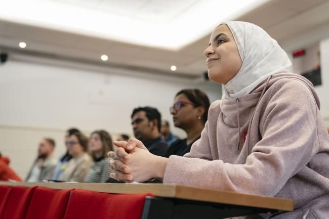People attending an event in Peter Lowe Lecture Theatre